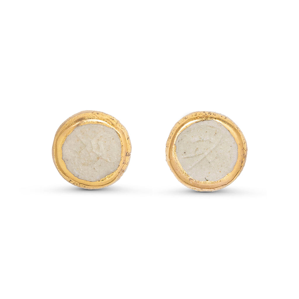 Crystal clear glass circular stud earrings outlined in gold lustre