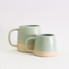 Small and large mint green stoneware mugs 