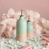 Large and small Cotton Candy oil pourers on table