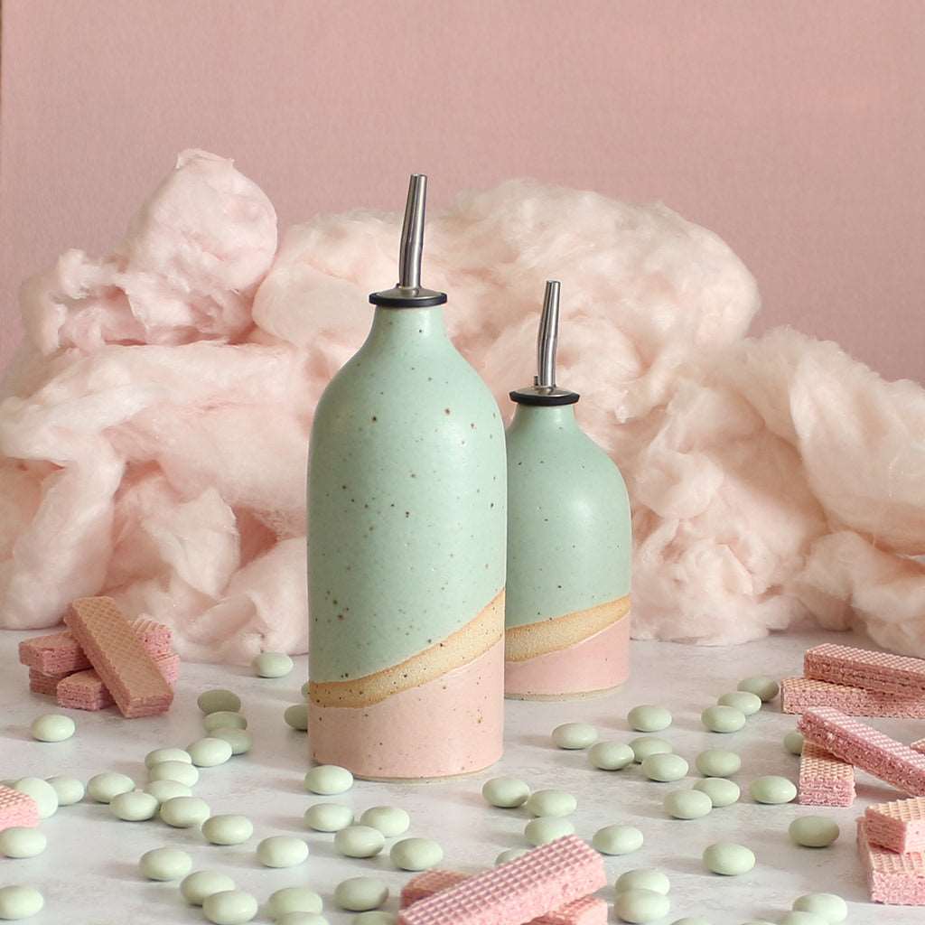 Large and small Cotton Candy oil pourers on table
