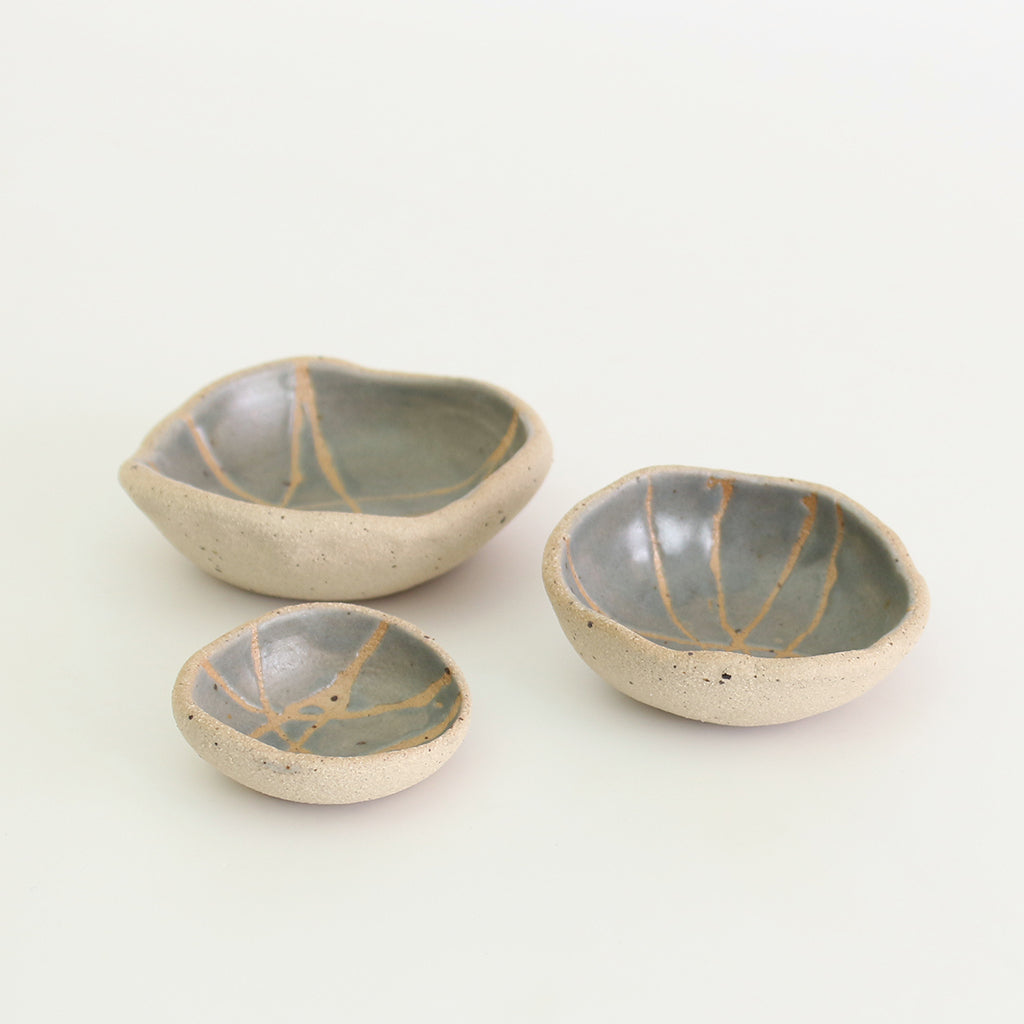 Internal grey patterned bowls in mini, small and medium sizes with raw clay exteriors