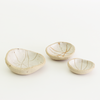 Internal white patterned bowls in mini, small and medium sizes with raw clay exteriors