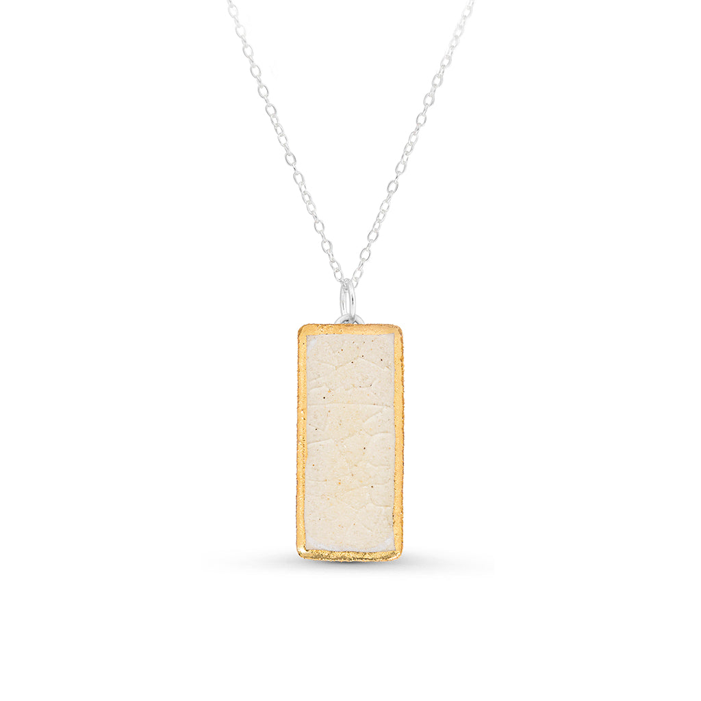 Crystal clear glass small rectangular drop sterling silver necklace outlined in gold lustre