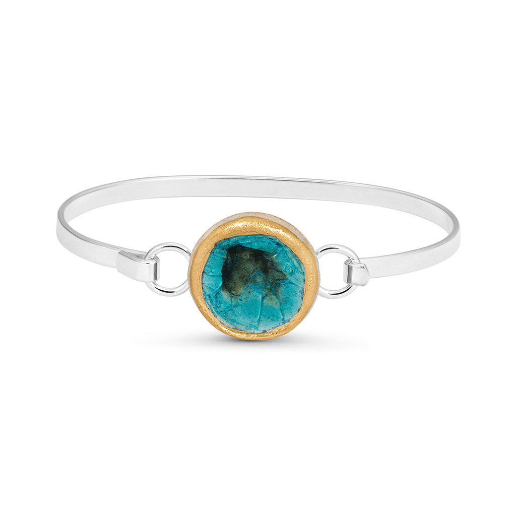 Turquoise reef crackled glass round charm outlined in gold lustre on a silver plated latch bangle